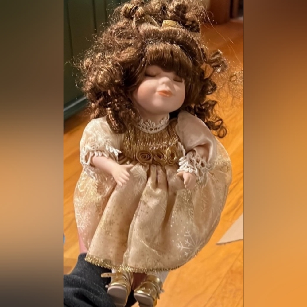 Vintage “Skylar” porcelain doll, moves to music